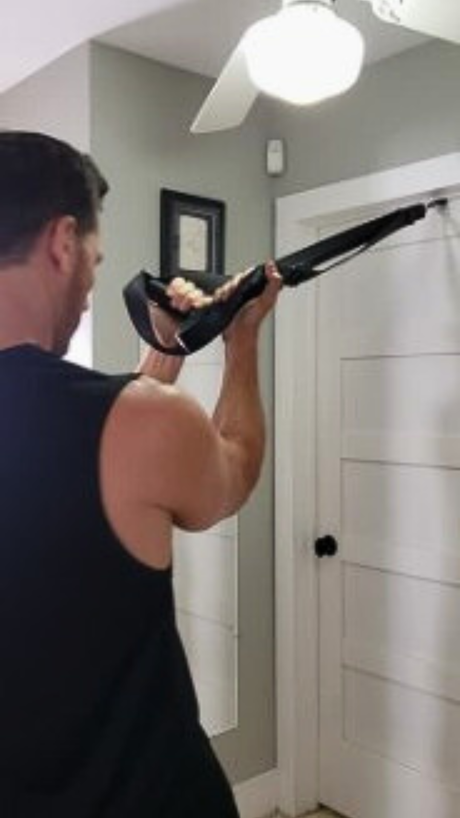 Athlete building muscle at home using NOSSK bodyweight training system