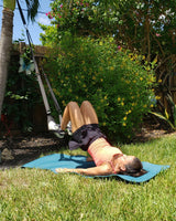 NOSSK TNT Pro suspension fitness trainer anchored to a hotel door for a bodyweight workout